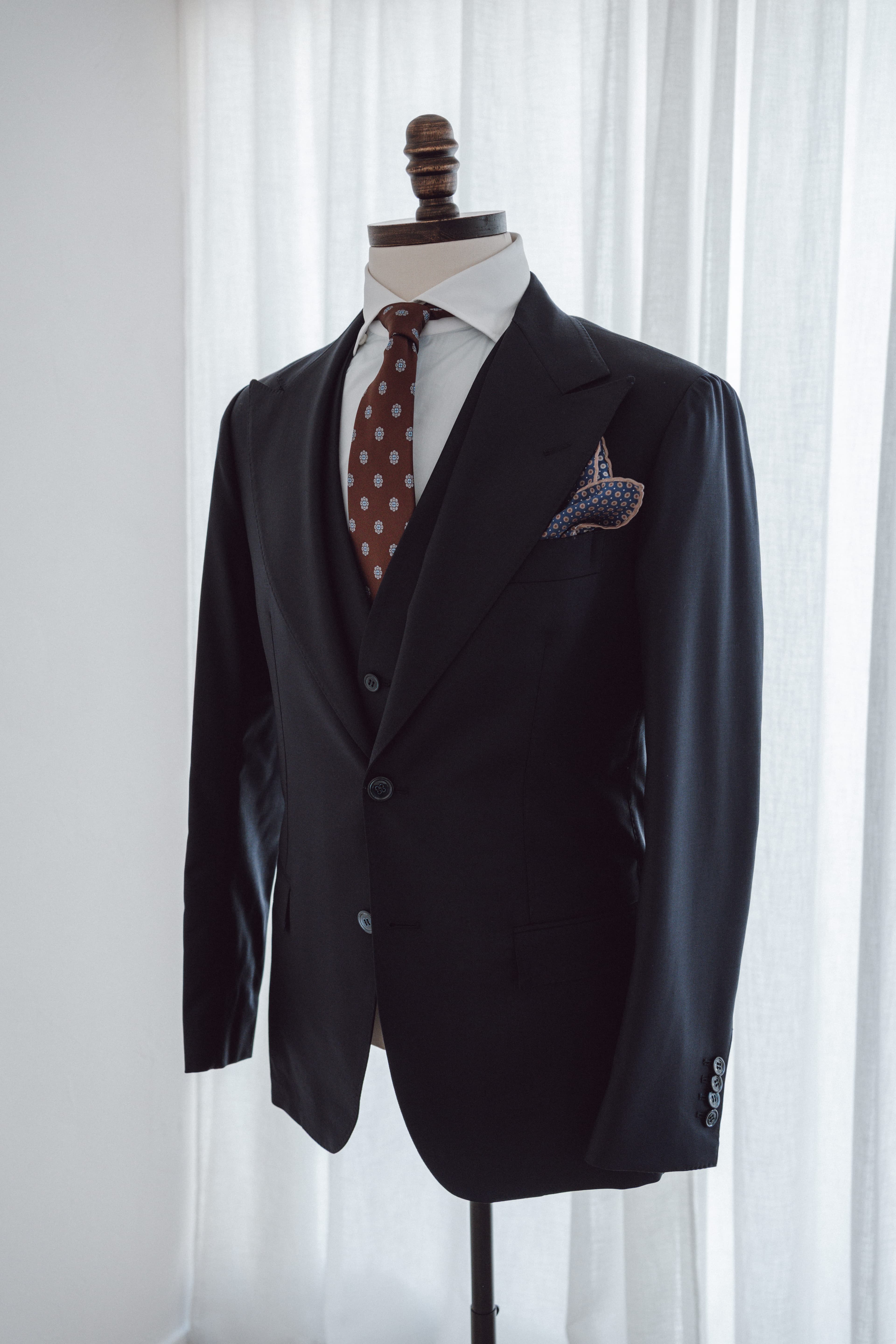 Tailoring atelier tools and fabric — made-to-measure service at FK Bespoke